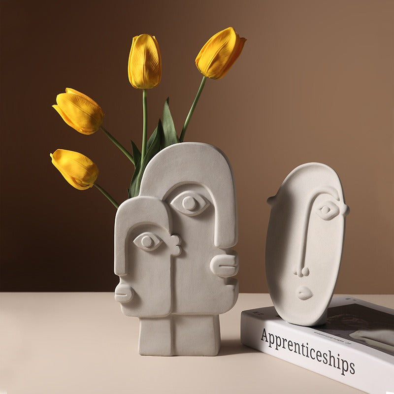 Geometric abstract face ceramic vase by Cavira, designer porcelain art vase for home decor, shelf styling, and gifting.