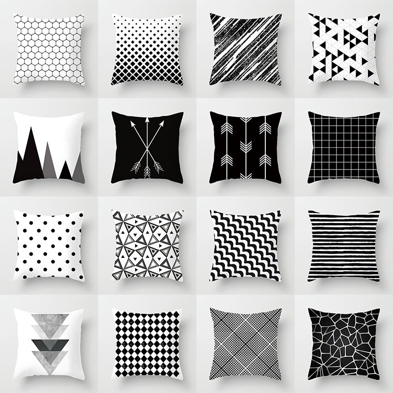 Black, white, and grey geometric jacquard knitted cushion cover by Cavira, ideal for sofa and home decor.