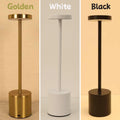 Minimalist Cavira iron desk lamp with touch dimmer, 3-color LED, cordless rechargeable design in white, black, or gold.