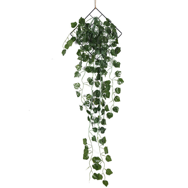 Artificial vine wall hanging decoration with faux green plants and iron ring, ideal for boho living room, bedroom, or study décor.
