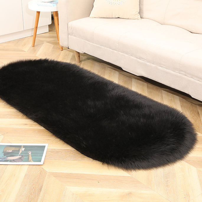 Oval acrylic plush rug by Cavira with soft imitation wool pile, available in 14 colors and four sizes for bedroom or living room.