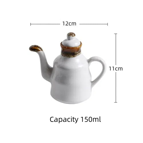 Cavira ceramic oil and vinegar dispenser bottle with auto-open lid in blue and white, 150ml for kitchen condiments and seasonings.