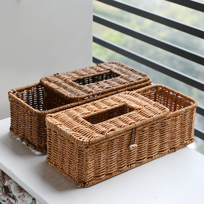 Dark and light plastic rattan-style tissue and remote control storage box, multifunctional for living and dining rooms.