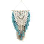Blue bohemian hand-knotted macramé wall tapestry with cotton tassels and wooden stick for home or wedding decor.
